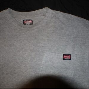 gray wrangler t-shirt with front pocket on the left hand side
